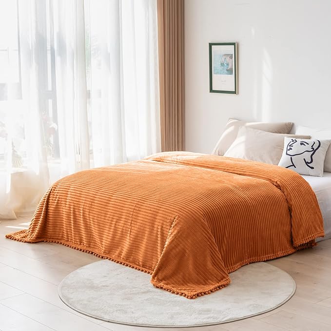 DISSA Fleece Blanket Throw Size – 51x63, Orange – Soft, Plush, Fluffy, Fuzzy, Warm, Cozy – Perfect Throw for Couch, Bed, Sofa - with Pompom Fringe - Flannel Blanket Throw Blanket