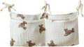Bedside hanging bag for storing baby milk bottles and blankets - Baby diaper folding bed organizer bag - White teddy bear